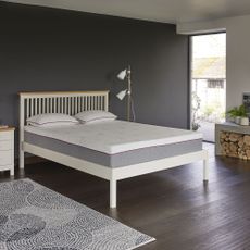 White bed in blue bedroom