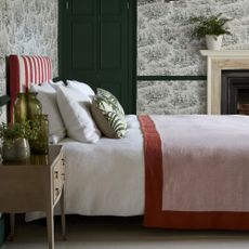 A bedroom decorted with Little Greene paint and National Trust Papers
