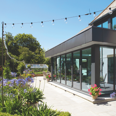 Festoon outdoor lights hanging outside house exterior